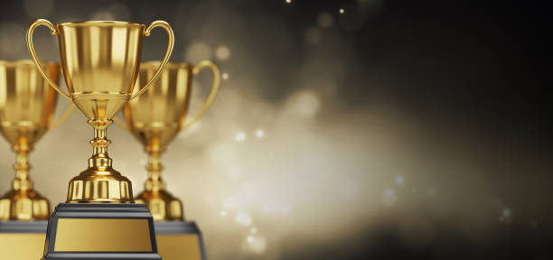 istock Golden trophy cup on dark background. copy space for text. 3d rendering. 1296652477
