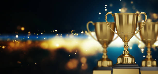 istock Golden trophy cup on dark background. copy space for text. 3d rendering. 1296652490