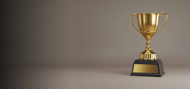 istock Golden trophy cup on dark background. copy space for text. 3d rendering. 1296652491