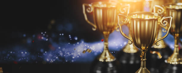 istock Golden trophy cup on dark background. copy space for text. 3d rendering. 1296652502