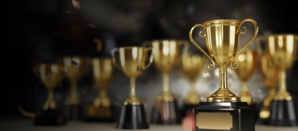 istock Golden trophy cup on dark background. copy space for text. 3d rendering. 1296652523