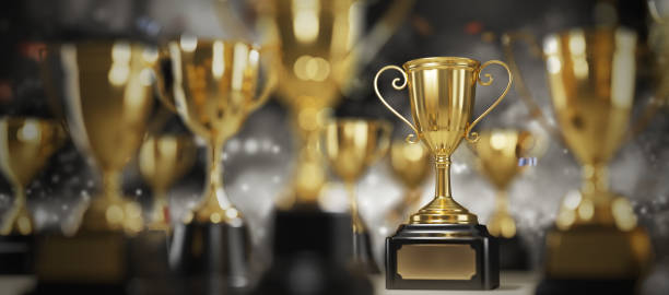 istock Golden trophy cup on dark background. copy space for text. 3d rendering. 1296652525