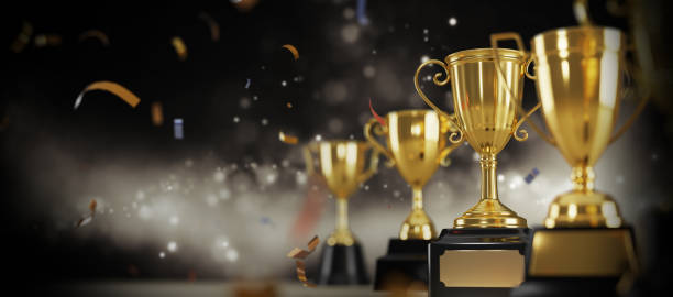 istock Golden trophy cup on dark background. copy space for text. 3d rendering. 1296652526