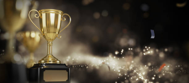 istock Golden trophy cup on dark background. copy space for text. 3d rendering. 1296652527