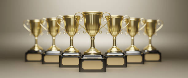 istock Golden trophy cup on gold background. copy space for text. 3d rendering. 1296652571