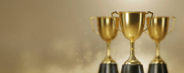 istock Golden trophy cup on gold background. copy space for text. 3d rendering. 1296652622