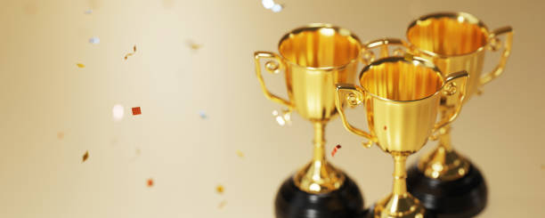 istock Golden trophy cup on gold background. copy space for text. 3d rendering. 1296652643