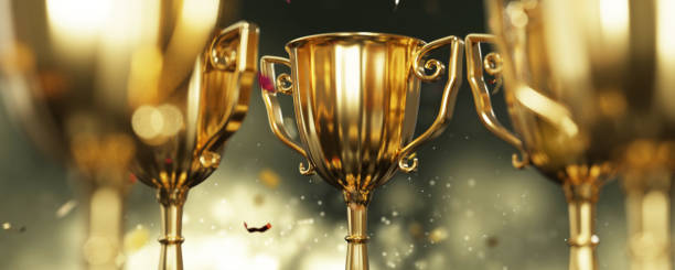 istock Golden trophy cup on dark background. copy space for text. 3d rendering. 1296652652