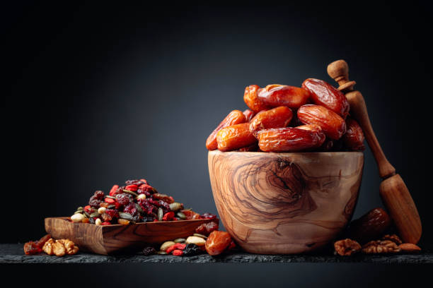 istock Dates and dried fruits, nuts and seeds. 1296653733