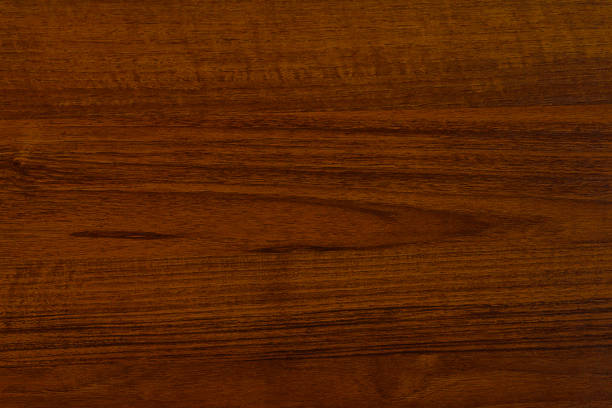 Polished wood surface. The background of polished wood texture. Polished wood texture. The background of polished wood texture. mahogany photos stock pictures, royalty-free photos & images