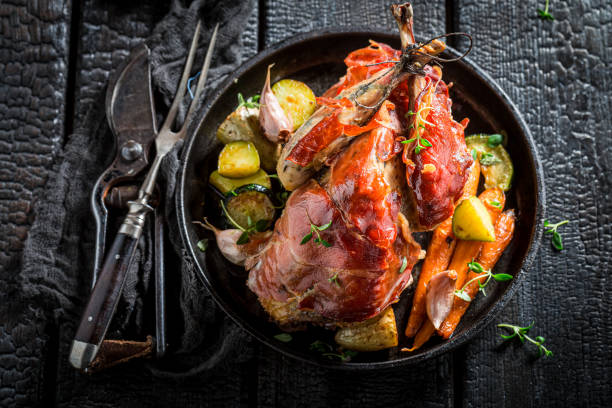 istock Top view of pheasant roasted with bacon and vegetables 1296660609