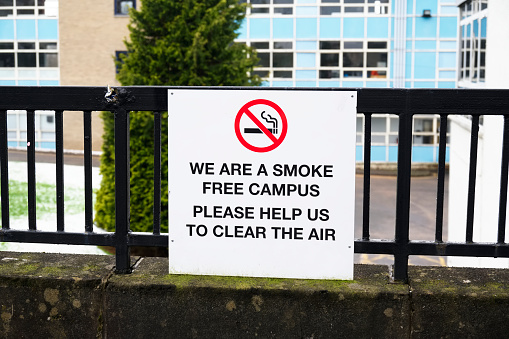 No smoking at college campus university school sign for students create smoke free environment air UK