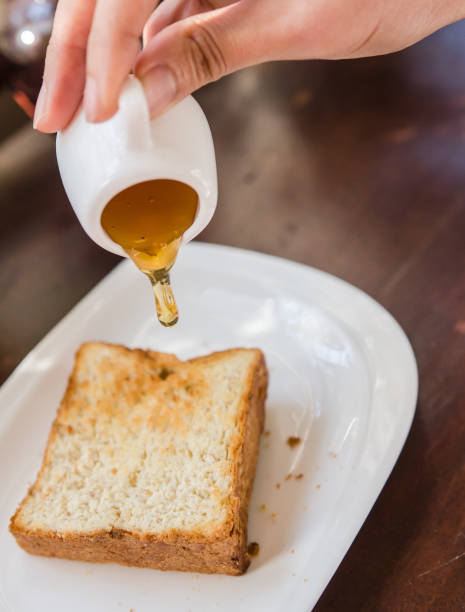 istock A slice of bread that sits on a wooden table. 1296666399