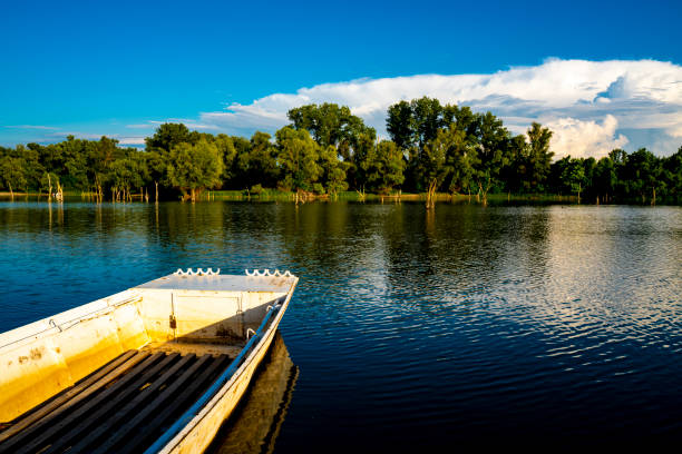 Small wooden boat on the calm lake