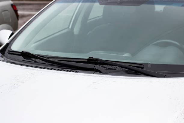 istock Hood of a white car with raindrops 1296667853