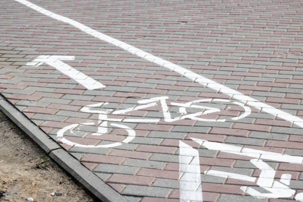 istock Marking a bike path on the sidewalk 1296668010