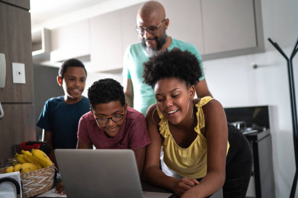 istock Family using laptop at home 1296671454