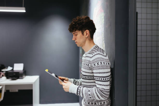 istock Young Businessman Using Digital Tablet In The Office 1296672056