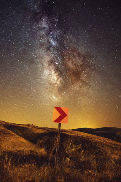 istock road and milky way galaxy 1296673205