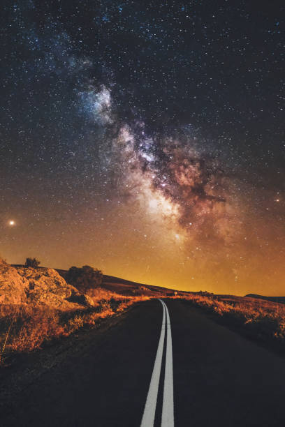 istock road and milky way galaxy and jupiter 1296673407