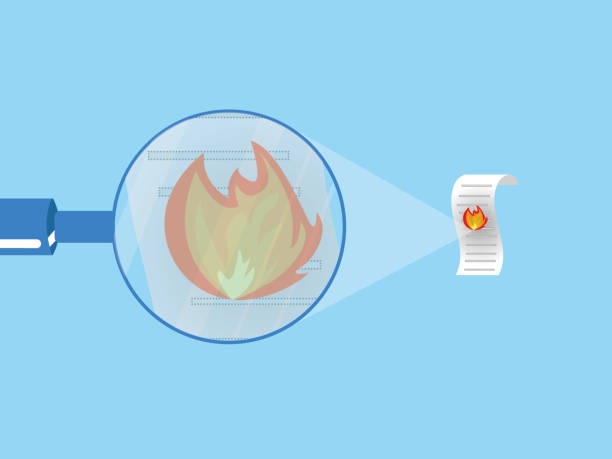 istock The stage of burning the document paper with a magnifying glass. 1296674227