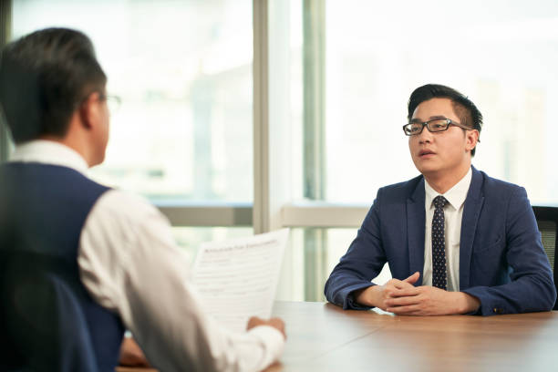 young asian job candidate being interviewed by hr manager stock photo
