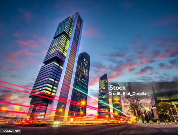 Madrid Traffic In Cuatro Torres Illuminated At Sunset Spain Stock Photo - Download Image Now
