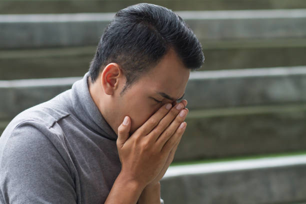 istock allergic sick asian man sneezing 1296679565