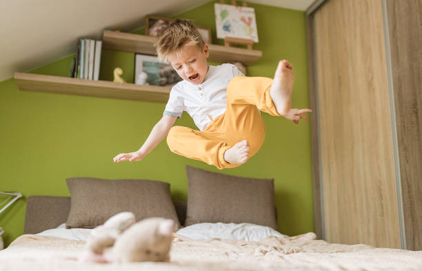 istock Jumping in the bedroom 1296679813
