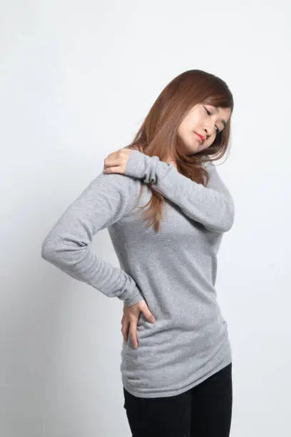 Photo of Young Asian woman got back pain.