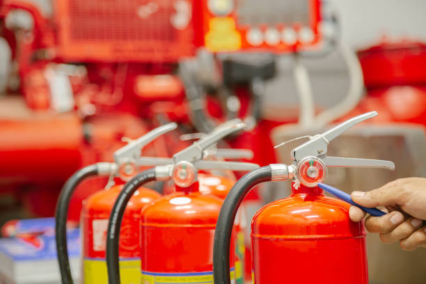 istock Engineer inspection Fire extinguisher and fire hose,Ready to use in the event of a fire.Safety first concept. 1296681953