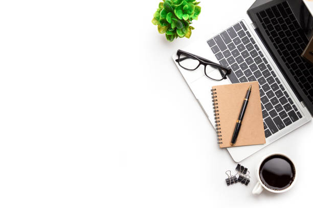 istock Flat lay, top view office table desk. Workspace with, laptop,office supplies, pencil, green leaf, and coffee cup. 1296681977