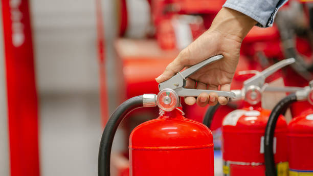 istock Engineer inspection Fire extinguisher and fire hose,Ready to use in the event of a fire.Safety first concept. 1296681992