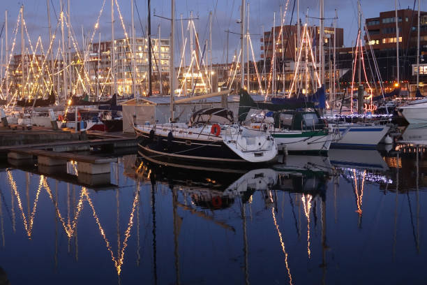 istock Illuminated sailing port in the night 1296682249