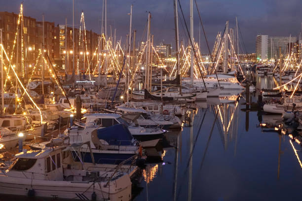 istock Illuminated sailing port in the night 1296682256