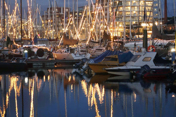 istock Illuminated sailing port in the night 1296682309
