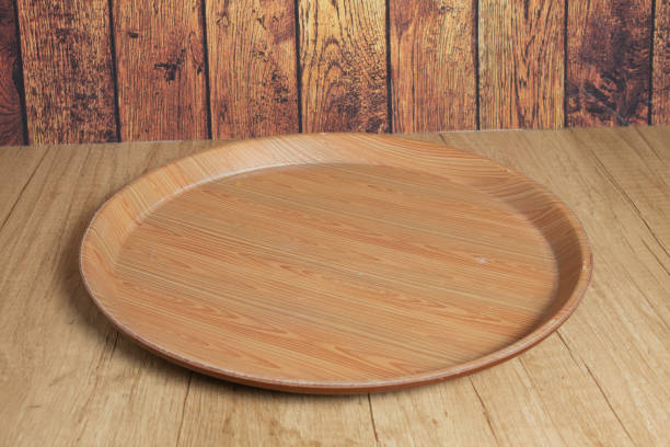 istock The brown wooden plate on a rustic table closeup. horizontal lateral view 1296683821