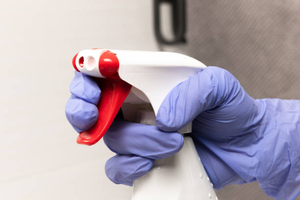 istock a bottle with a spray bottle and a red button with window and glass cleaner 1296684708