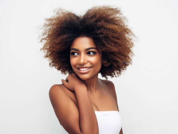 istock Beautiful smiling girl with curly hairstyle 1296684871