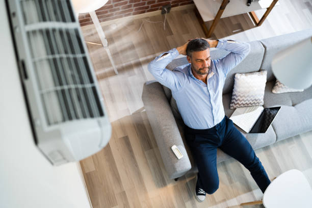 istock Air Conditioner On Wall In Living Room 1296685278