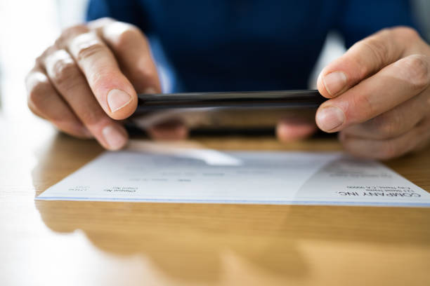 istock Remote Check Deposit Taking Photo 1296686672