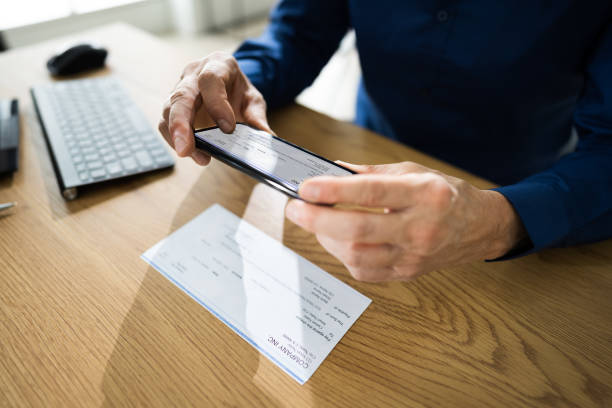 istock Remote Check Deposit Taking Photo 1296686684