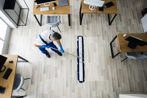 istock Male Janitor Mopping Floor In Face Mask 1296687868