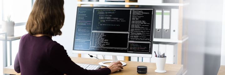 Software Programmer Or Coder Woman Using Office Computer