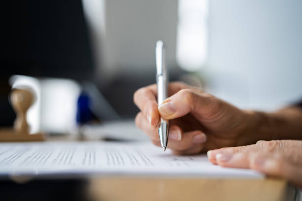 Lawyer Signing Business Contract Document