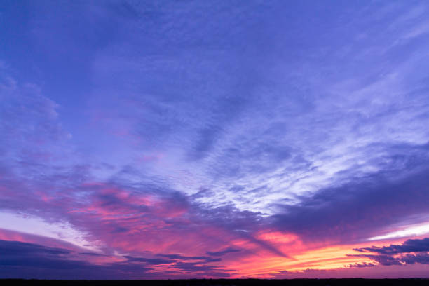 istock Colorful sunset with clouds in the evening 1296693085