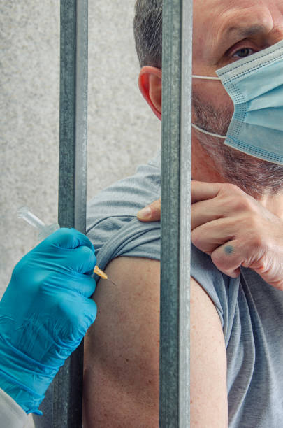 Prisoner needs to be vaccinated against COVID-19 stock photo