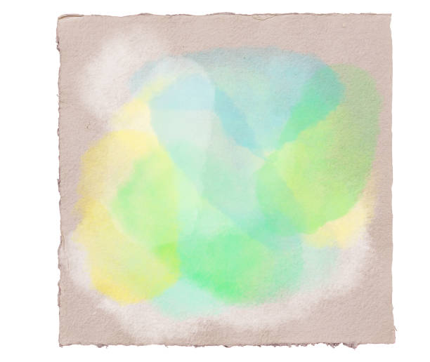 istock Abstract watercolor pastel splashes in blue, green,  turquoise and yellow on handmade rough aquarell paper sheet. 1296696447