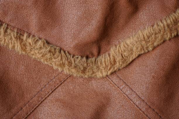 istock brown leather texture with a seam and a strip 1296702648