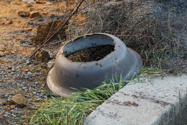 istock garbage from an old gray metal round broken basin with a hole without a bottom 1296702724